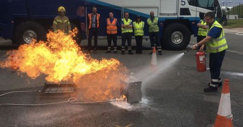 AWCC student undertaking a first response to putting out a fire